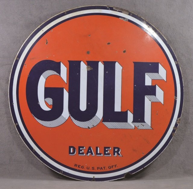 Round Gulf Dealer Sign: Double sided porcelain having navy blue "Gulf/ Dealer/ Reg. U.S. Pat. Off." on orange ground. Navy blue and white border. Some loss of finish and minor rust. 66" Dia.