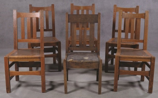 Set of Five Stickley Bros. Co. Chairs: "Quaint Furniture, Grand Rapids Mich." With nail head trim and faux leather seats. 38" H. Also includes similar chair, 36" H.