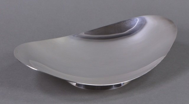 Tiffany Sterling Modernist Bowl: Of oval boat form. With raised foot rim. 2 1/2" x 12 1/2" x 7 3/4". Marked "Tiffany & Co./ Makers/ Sterling Silver/ 23415/ M." Mid 20th century. 22.98 T. oz. weighable sterling.
