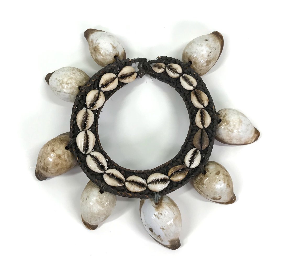 Tanimbar Islands Indonesia Ceremonial Necklace: Tanimbar Islands Indonesia Ceremonial Necklace.Plant fiber, fiber, shells. It measures 10 ¾ end to end. Shells are 3 inches the longest on