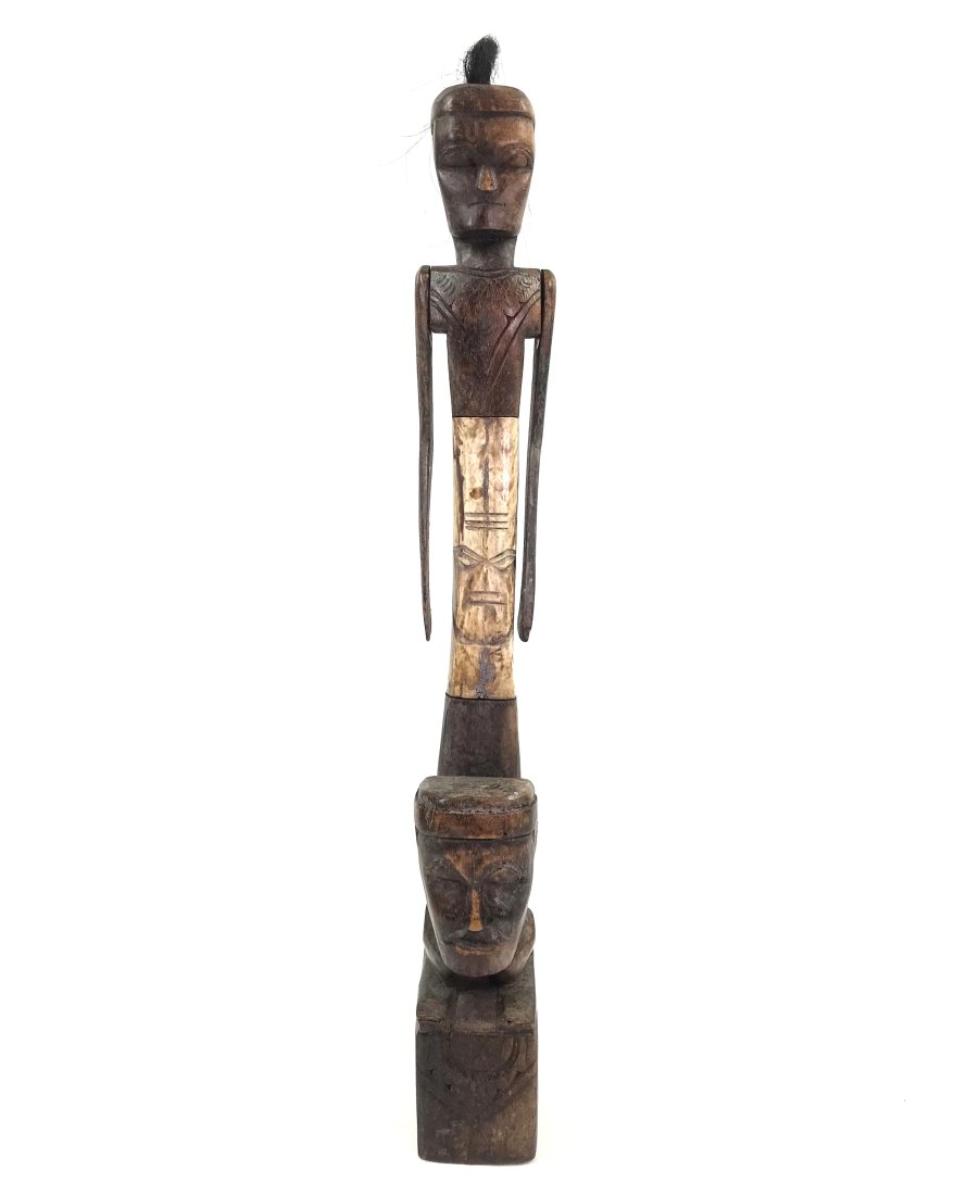Lombok Island Indonesia Articulated Figure: Lombok Island, Indonesia, articulated figure. Carved wood, bone. It measures 16 inches high, 1 1/4 inches wide and 2 ½ in
