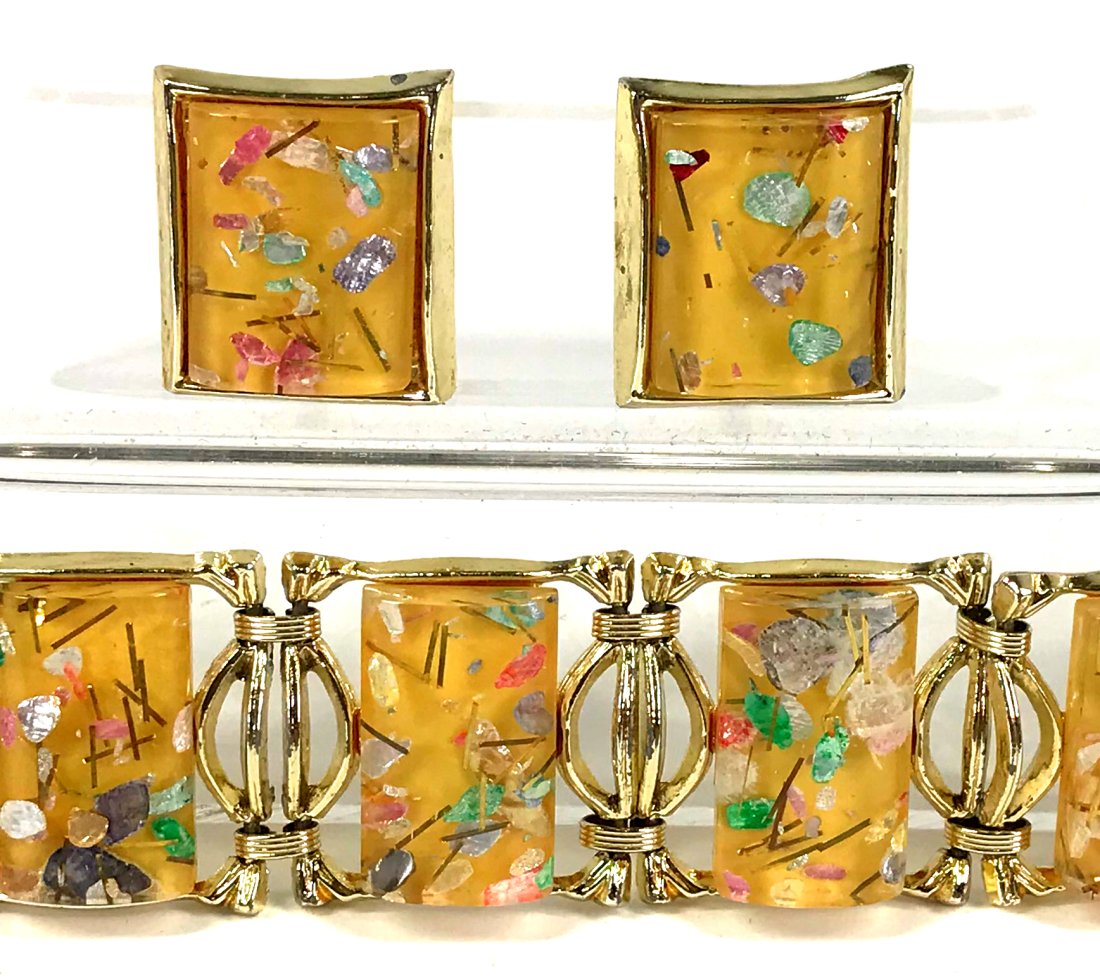 Vintage Confetti Lucite Panels Bracelet & Earrings.: Vintage color confetti inlaid lucite gold toned metal panels bracelet and clip on earrings. Unmarked. For measures please refer to the picture taken with a measure tape. Weight : 120 Grams. This is a