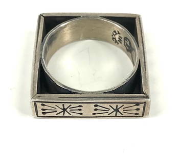 Vintage Mexican Ethnic Taxco Sterling Square Ring.: Vintage Mexican ethnic different decorations on each side sterling silver square ring . Marked Taxco 925 Eagle mark and Hallmark. Size 10 (please refer to picture taking with sizer). For measures plea