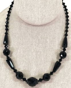 Vintage Czech Faceted Black Glass Beaded Necklace: Vintage Czech faceted black glass beaded necklace. Marked on clasp Made Czechoslov. For measures please refer to the picture taken with a measure tape. Weight: 24 Grams. This is a NO RESERVE AUCTION: