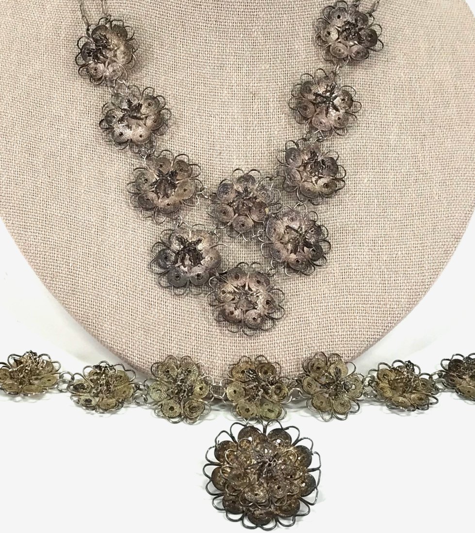 Vintage Filigree 800 Silver Flowers Necklace Bracelet Brooch Set.: E 21Vintage Filigree 800 Silver Flowers Necklace, Bracelet and Pin Brooch Set. Unmarked. For measures please refer to the picture taken with a measure tape. Weight: 38 Grams 100 -150 50Original Patina