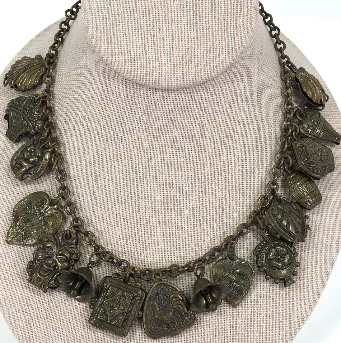Vintage Brass Folded Charms Chain Collar Necklace: Vintage Brass Folded Charms Chain Collar Necklace . Unmarked . For measures please refer to the pictures taken with a measuring tape. Weight: 45 Grams. This is a NO RESERVE AUCTION: there are no hidde
