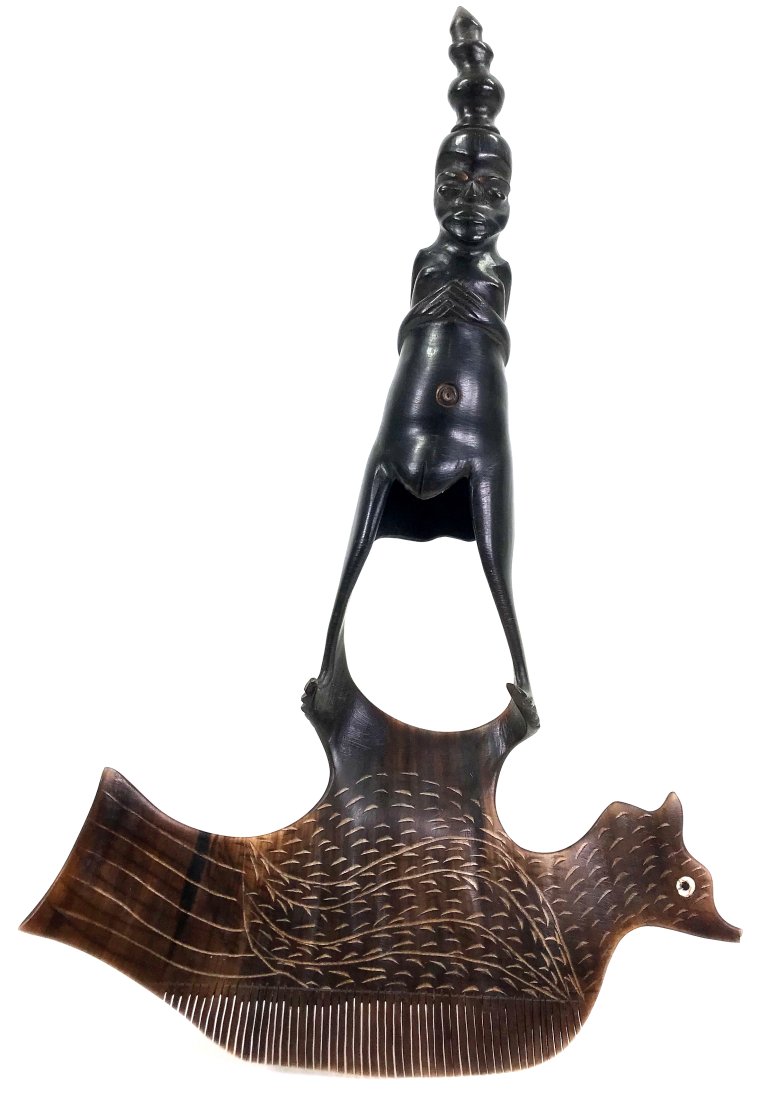 Sulawesi Toraja, Indonesia, Comb.: Sulawesi Toraja, Indonesia, Comb. Carved water buffalo horn. It measures 9 1/2 inches long and 6 1/2 inches widest. Weight: 2 oz. This is a NO RESERVE AUCTION: there are no hidden or confidential rese