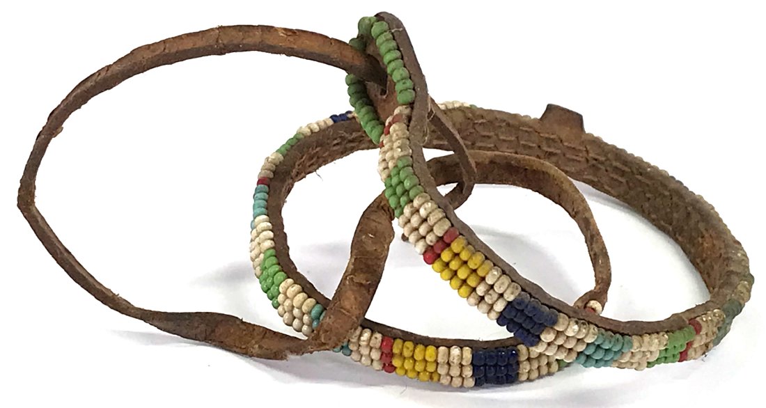 Vintage African Maasai Kenya glass beaded leather choker necklace: Vintage African Maasai Kenya glass beaded leather choker necklace. It measures 20 inches long end to end. For measures please refer to the picture taken with a measuring tape. Weight: 14 Grams. This i