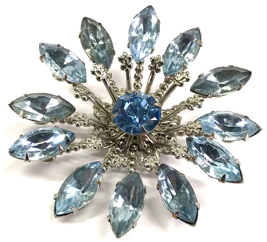 Vintage Judy Lee style crystals filigree silvertone flower brooch.: Vintage Judy Lee style skyblue crystals filigree silvertone metal flower pin brooch. Unmarked. For measures please refer to the picture taken with a measuring tape. Weight: 18 Grams. This is a NO RESE