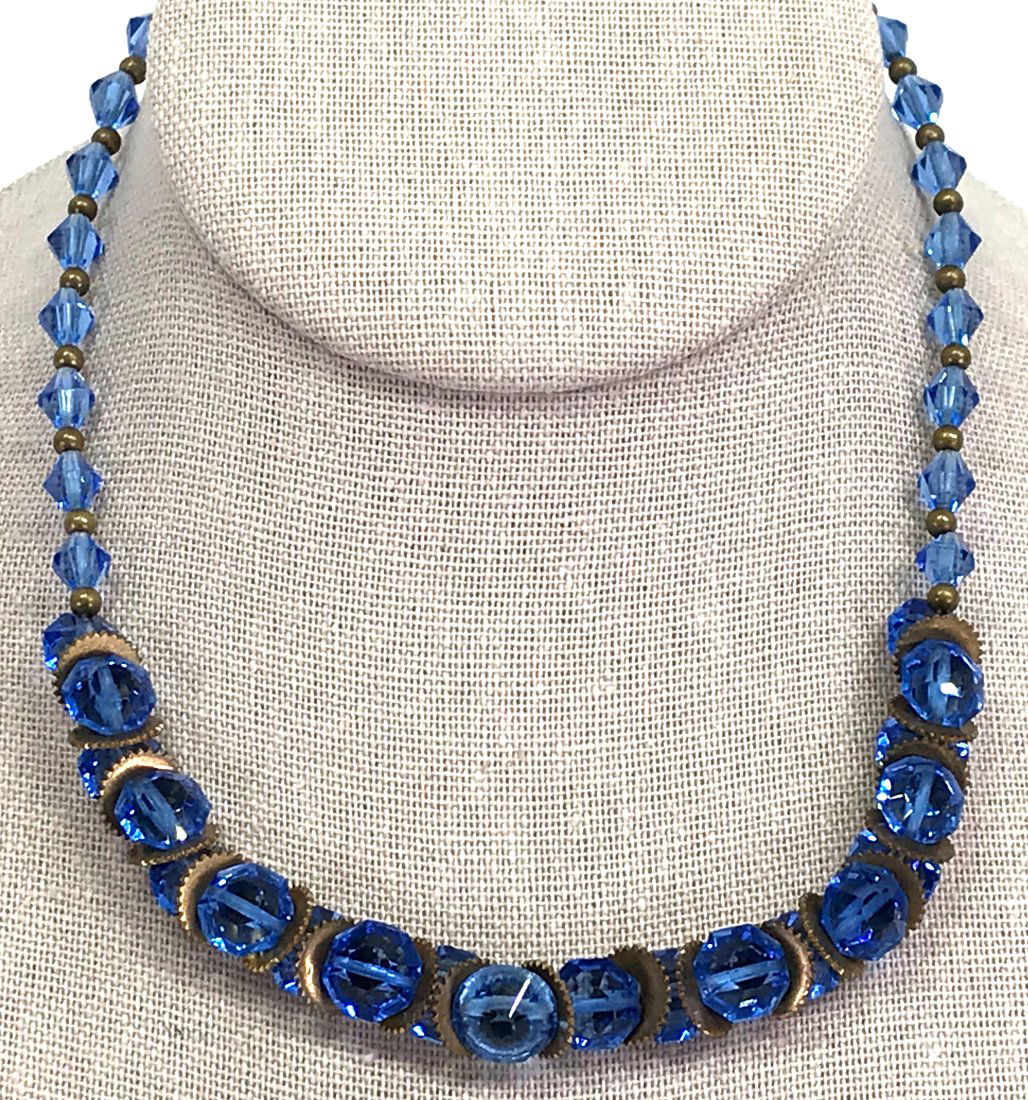 Antique art deco faceted blue crystals collar necklace.: 257Antique art deco faceted blue crystal beads goldtone metal spacers collar necklace. For measures please refer to the picture taken with a measuring tape. Weight: 25 Grams. This is a NO RESERVE AUCT