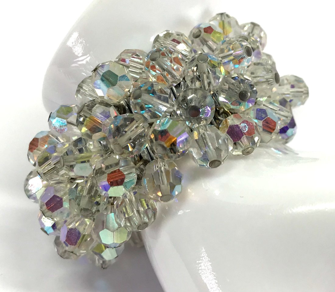 Vintage Japanese faceted AB crystals silvertone expandable bracelet.: Vintage Japanese faceted AB crystals dangles silvertone metal accordion expandable bracelet. Marked Made in Japan. For measures please refer to the picture taken with a measuring tape. Weight: 88 Gram
