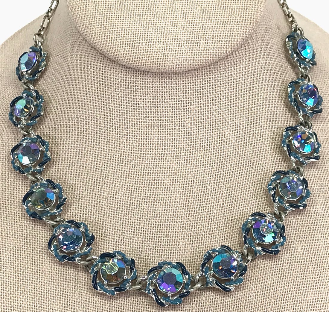 Vintage AB blue crystals enamel silvertone metal flowers choker necklace.: Vintage AB blue crystals enamel silvertone metal flowers choker necklace. Unmarked. For measures please refer to the picture taken with a measuring tape. Weight: 38 Grams. This is a NO RESERVE AUCTION