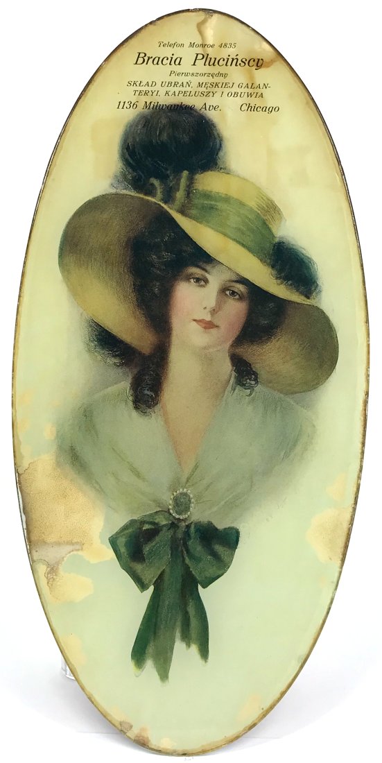 Antique Edwardian woman feathers hat large eglomise print glass advertising: Antique edwardian woman feathers hat large eglomise reverse print on glass advertising from a Hat, shoes, clothing store in Chicago. It is not hand painted. It reads in Polish: Bracia Plucinscy Pierws
