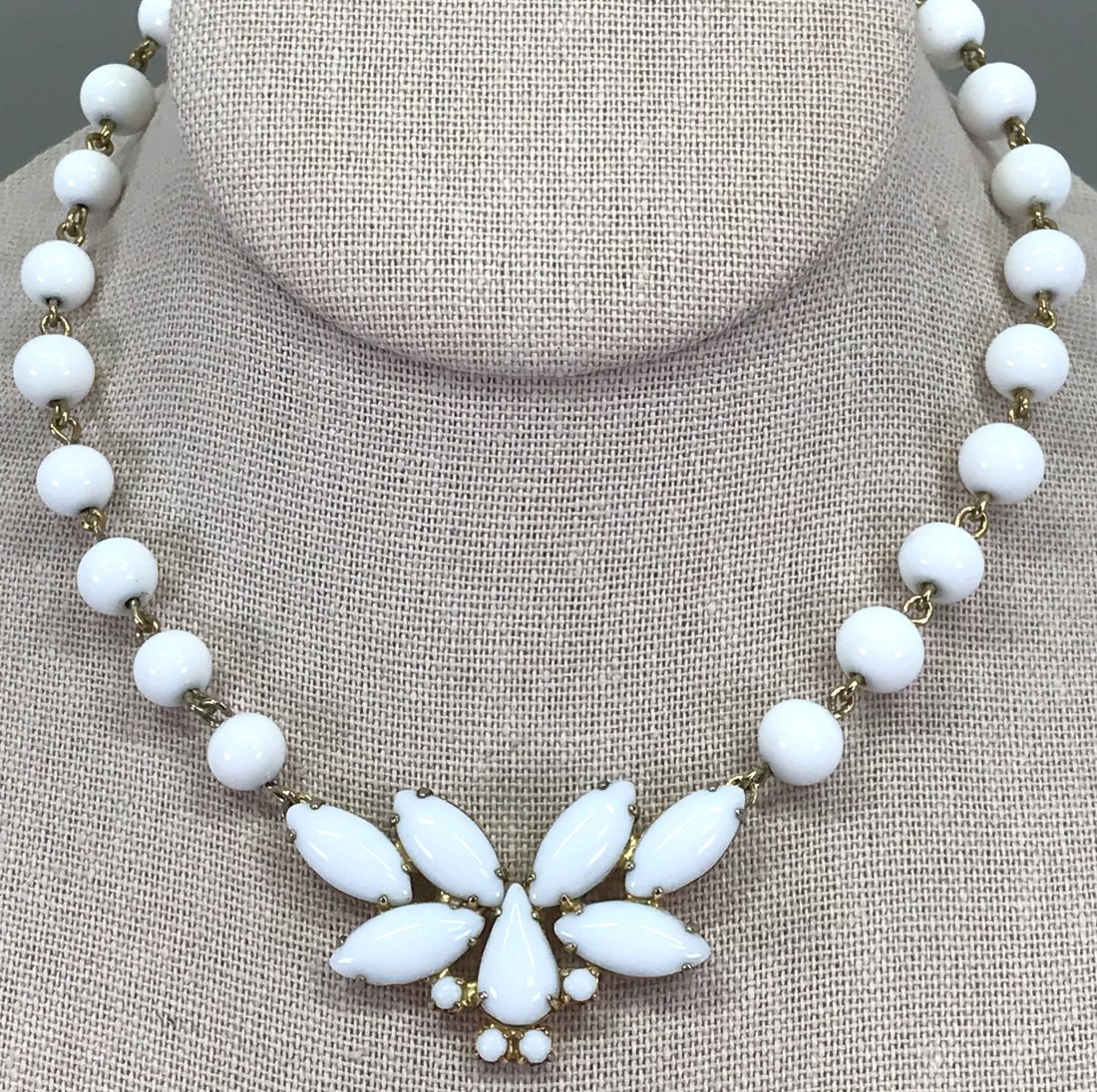 Vintage Juliana Style milky white glass butterfly choker necklace.: Vintage Juliana Style milky white glass butterfly medallion goldtone metal choker necklace. Wired milky white glass beads strap. Unmarked. For measures please refer to the picture taken with a measuri