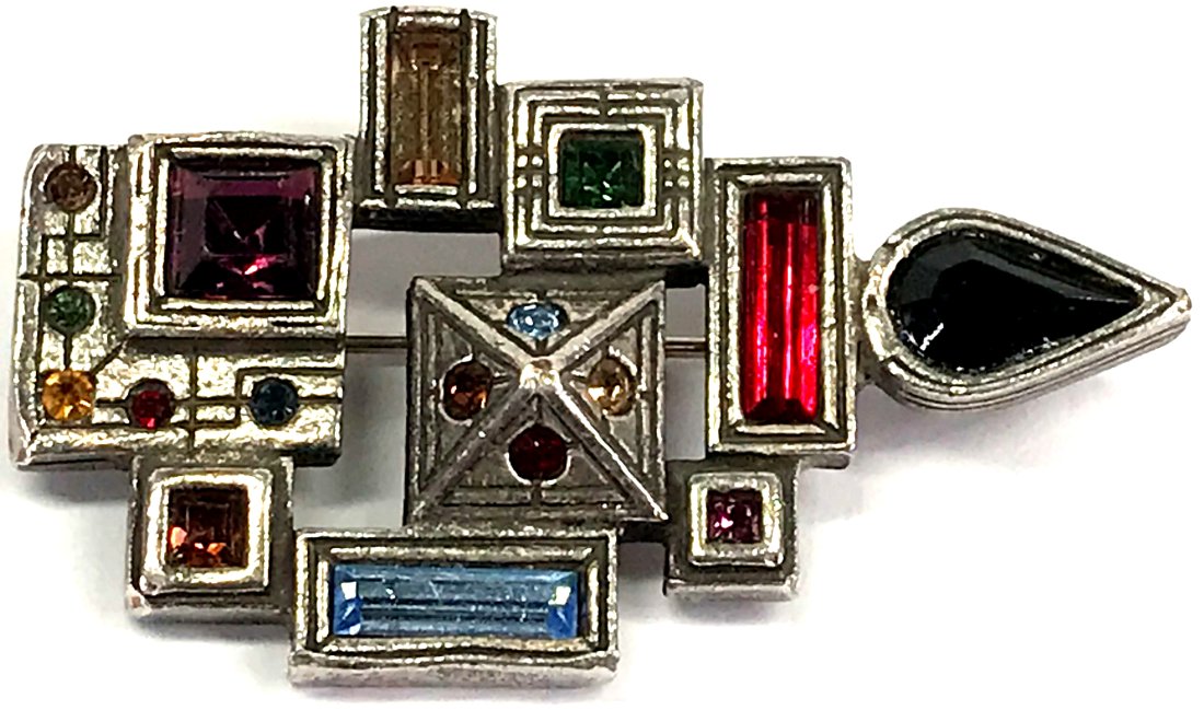 Vintage Patricia Locke Color Crystals Silvertone Metal Pin Brooch.: Vintage Patricia Locke Color Crystals Silvertone Metal Pin Brooch. Signed. For measures please refer to the picture taken with a measuring tape. Weight: 15 Grams. This is a NO RESERVE AUCTION: there a