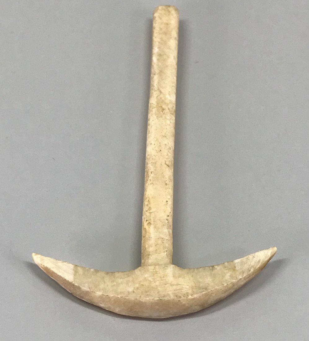 Antique Inuit Model of a Miner"s Pick.: Antique Inuit Model of a Miner”s Pick. Bone. For measures please refer to the picture taken with a measuring tape. This is a NO RESERVE AUCTION: there are no hidden or confidential reserves, all