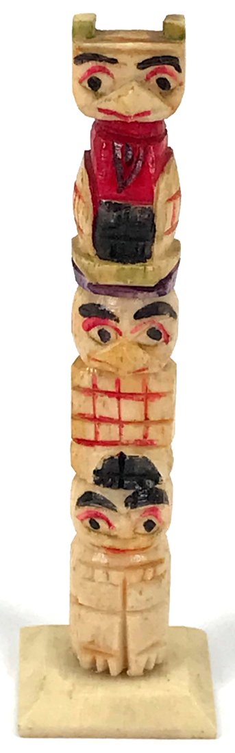 Vintage Northwest Coast Miniature Totem Pole.: Vintage Northwest Coast Miniature Totem Pole. Polichrome carved bone. Marked Wisconsin Dells. For measures please refer to the picture taken with a measuring tape. For measures please refer to the pic
