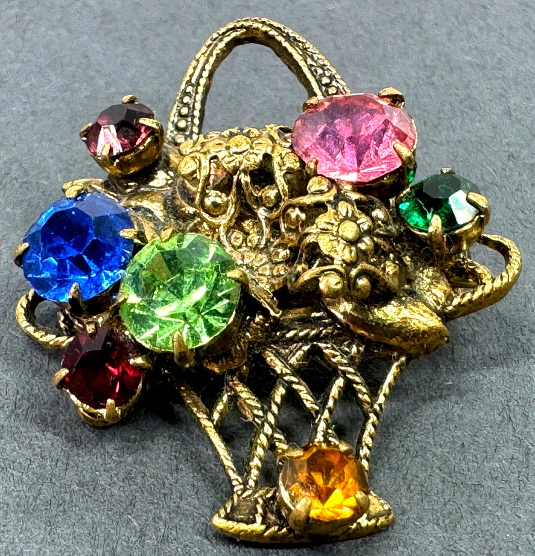 Vintage Czech color crystals basket with flowers pin brooch.: Vintage Czech color crystals filigree goldtone metal basket with flowers pin brooch. Unmarked. For measures please refer to the picture taken with a measuring tape. Weight : 4 Grams. This is a NO RESE