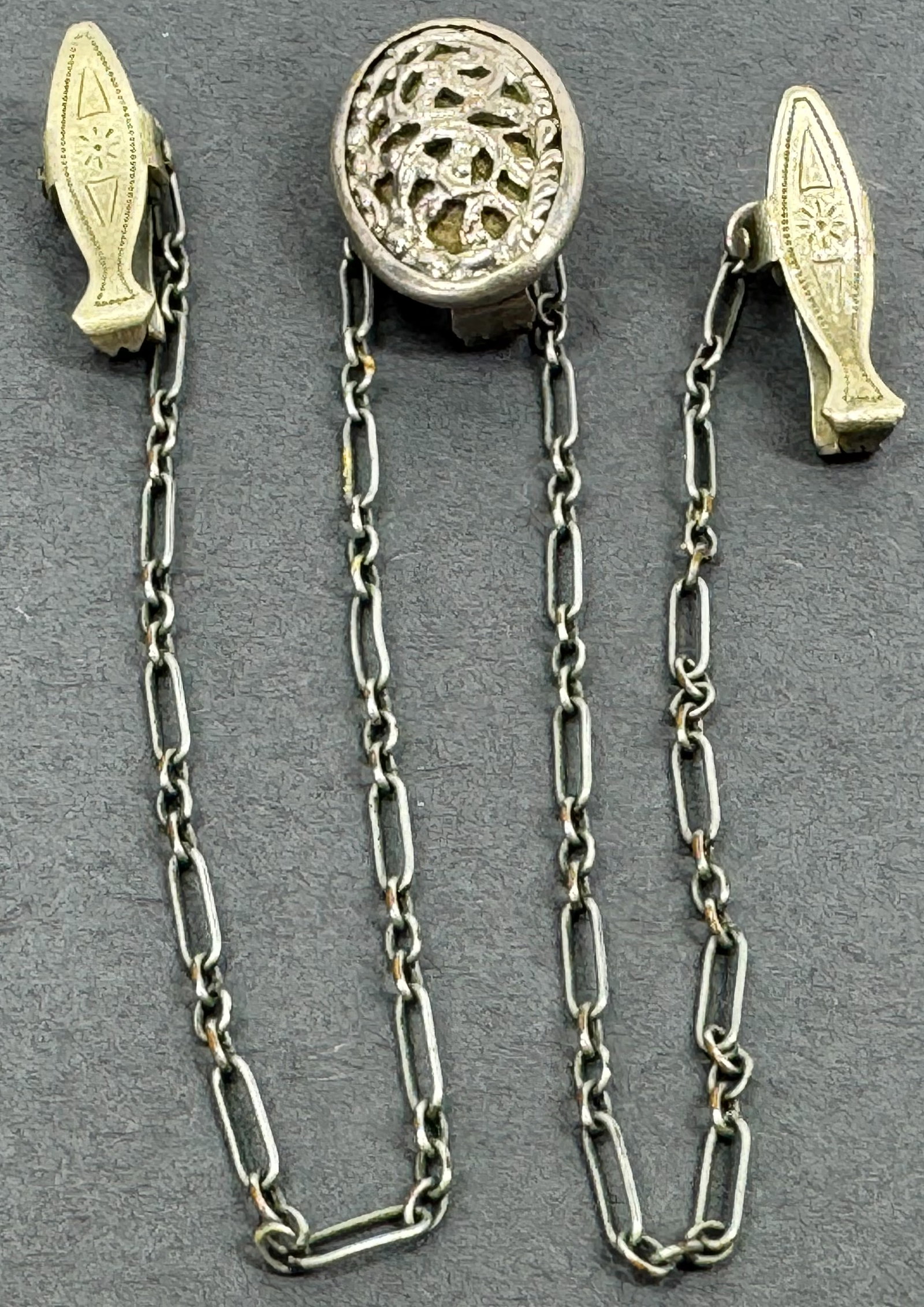 Antique Victorian silvertone metal lingerie chained clip brooches.: Antique Victorian silvertone metal lingerie chained clip brooches. Marked Pat”D and Pat Pending. < For measures please refer to the pictures taken with a measuring tape. Weight: 5 Grams. This is