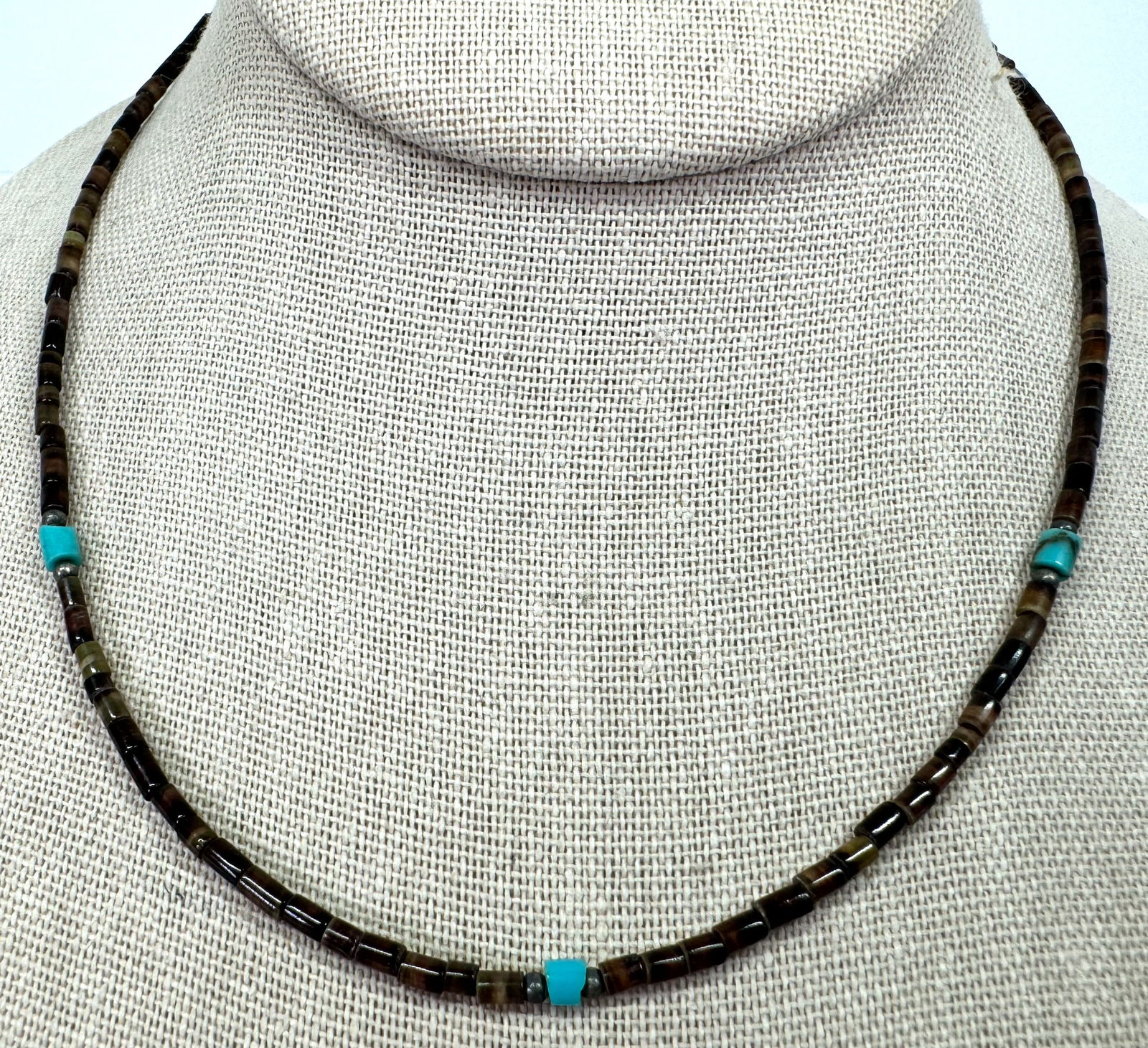 Vintage native american heishi shell turquoise & sterling silver beads choker necklace.: Vintage native american heishi shell, reconstituted turquoise stone & sterling silver rounded beads choker necklace. It measures around 16 inches long end to end. Clasp is not sterling For measures pl