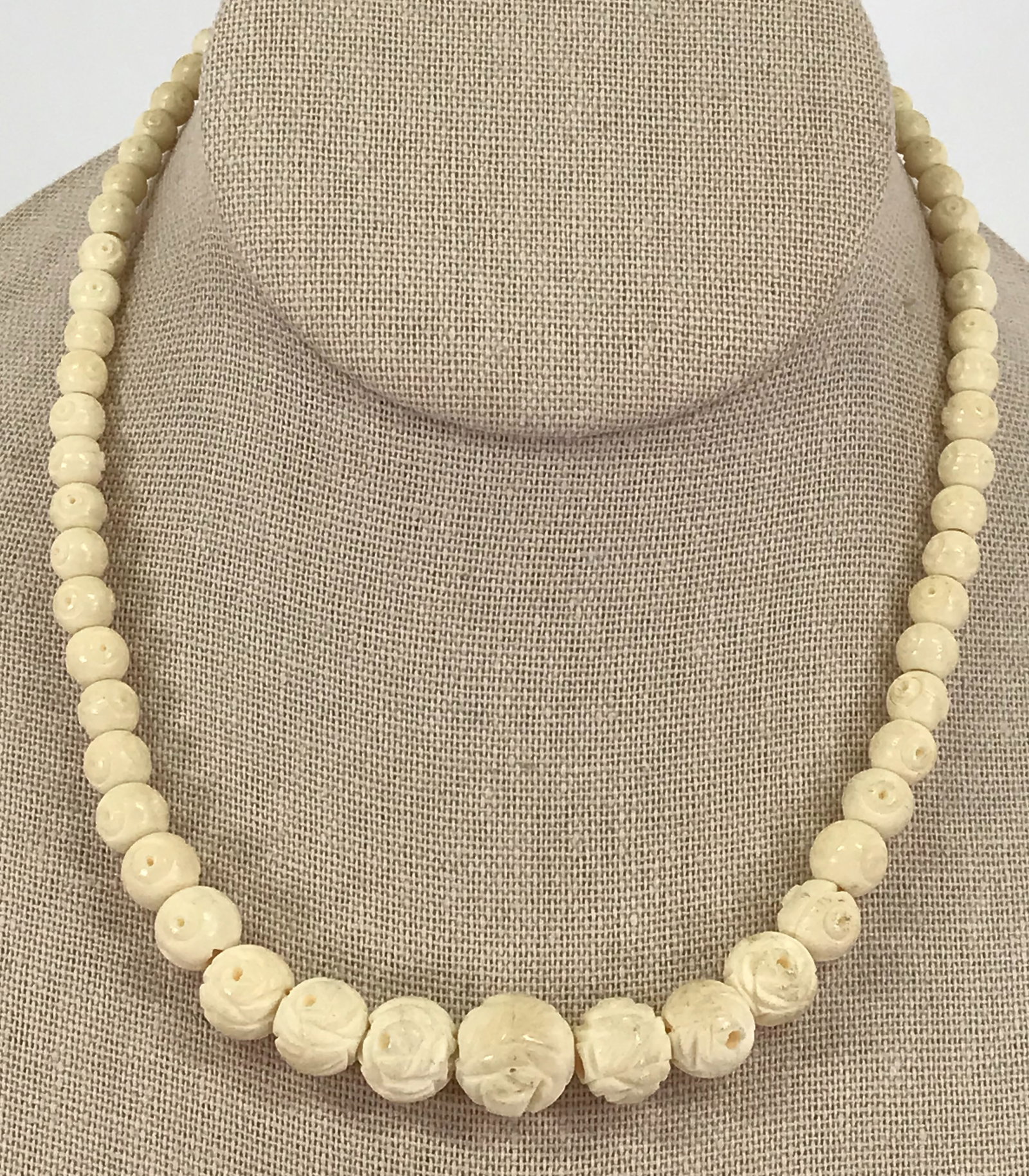 Vintage Japanese carved bone flower beads choker necklace.: Vintage Japanese carved bone flower beads choker necklace. Marked Japan on clasp. For measures please refer to the picture taken with a measuring tape. Weight : 18 Grams. This is a NO RESERVE AUC