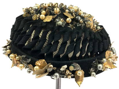 Vintage Powell"s Chicago embroidery metal leaves, pearly & glass beads black hat.: Vintage Powell"s Chicago embroidery metal golden leaves, faux pearls & glass beads black hat. Fabric Label. No size label. It measures around 21 inches in the interior circumference. Dirt, leaves miss