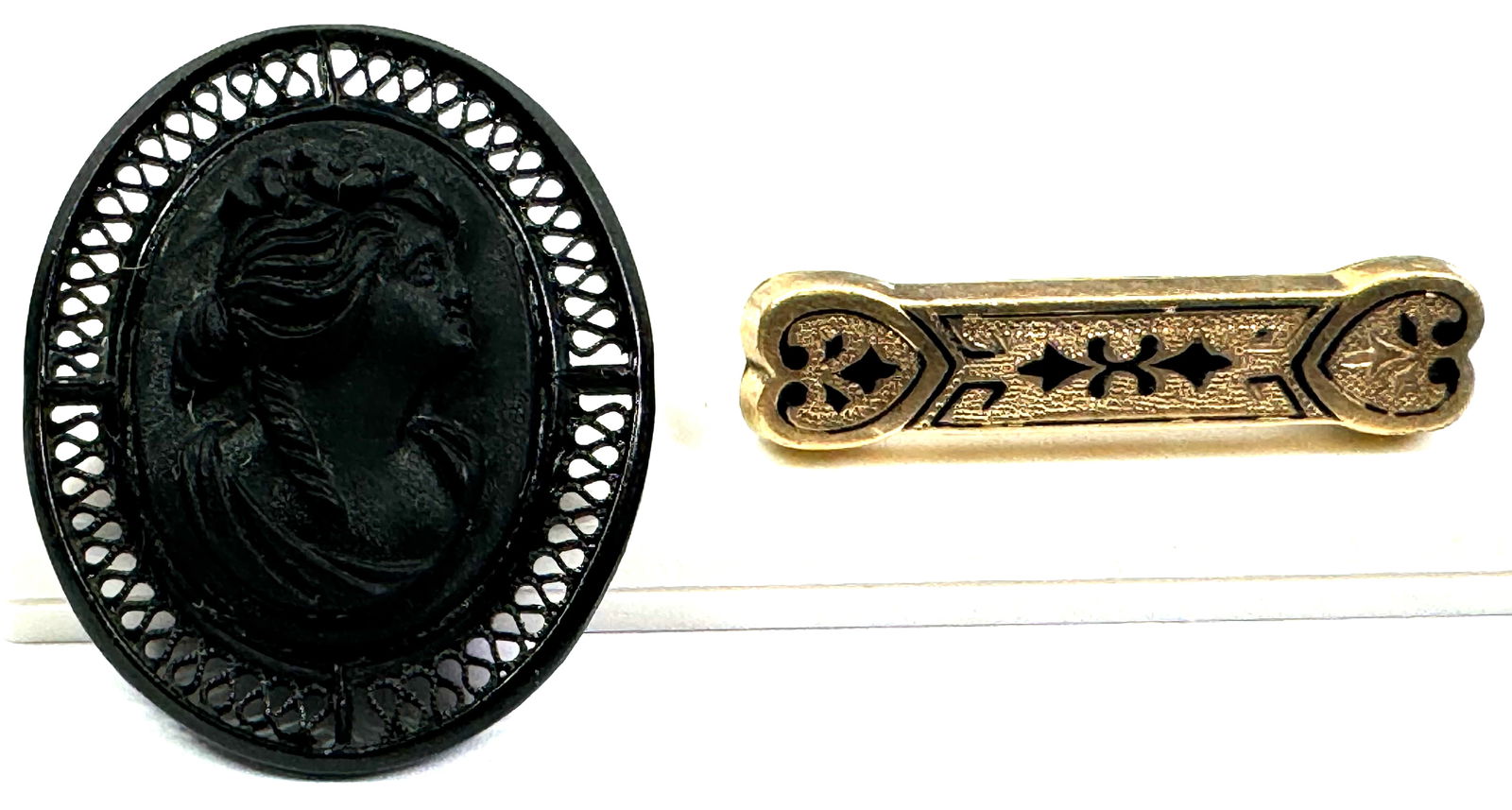 Antique victorian black enamel gold filled and black painted metal and celluloid cameo brooches. (1 of 6)