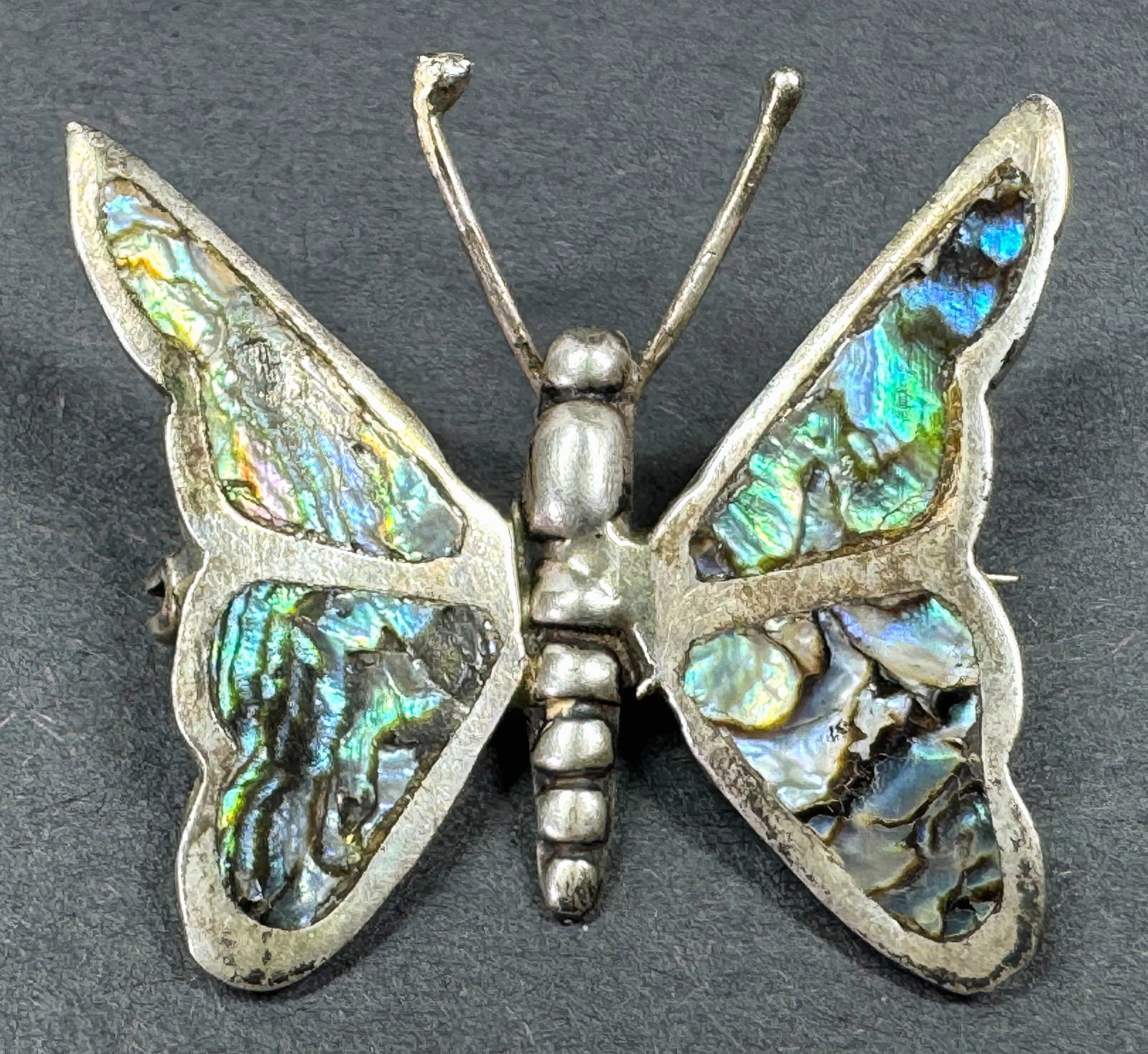 Vintage GON Mexico inlaid abalone sterling silver butterfly pin brooch.: Vintage GON Mexico inlaid abalone sterling silver butterfly pin brooch. Marked. For measures please refer to the pictures taken with a measuring tape. Weight: 3.42 Grams. This is a NO RESERVE AUCTION: