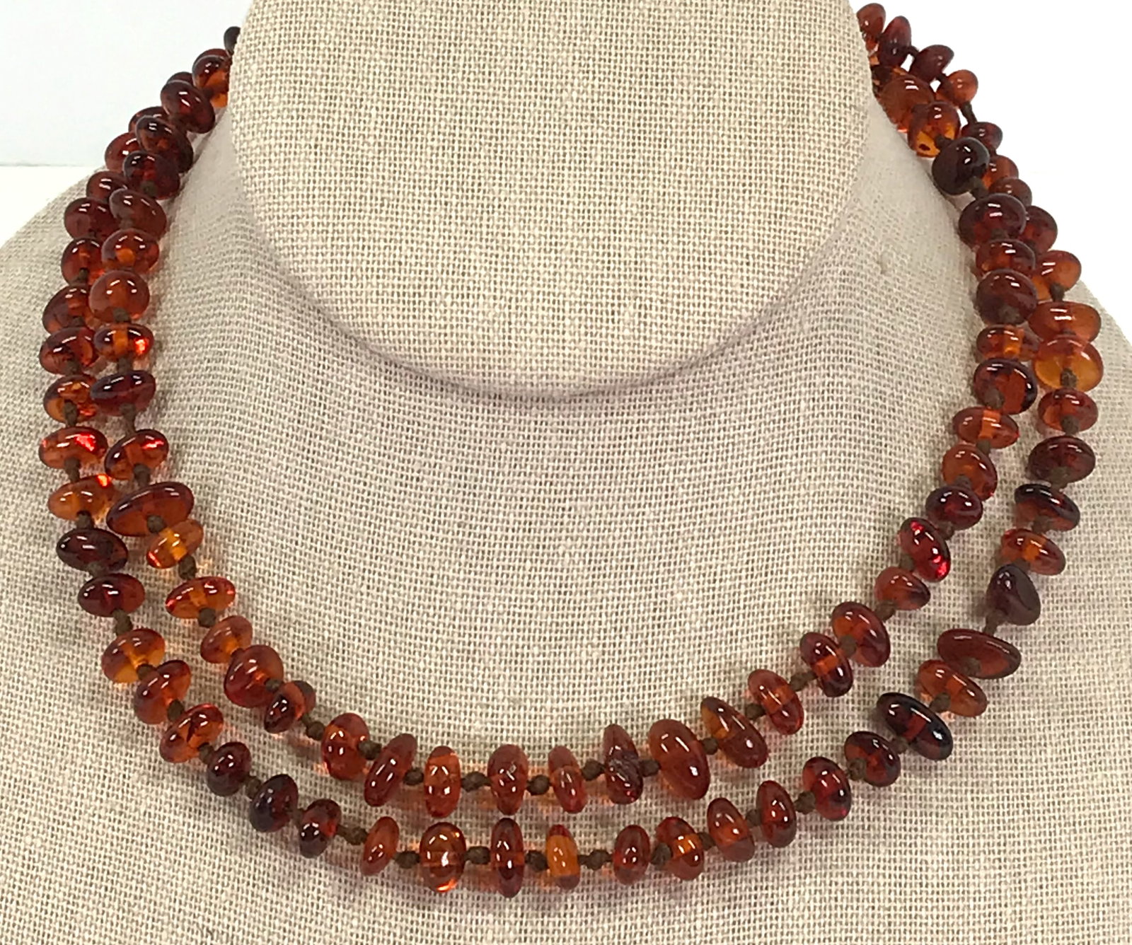 Vintage Bernstein Werkstatten Polished Amber Nuggets Necklace: Vintage 70"s Bernstein Werkstatten Polished Amber Nuggets Necklace. Hand knotted in between. Original Cardboard Box. For measures please refer to the picture taken with a measuring tape. Weight: 16.56