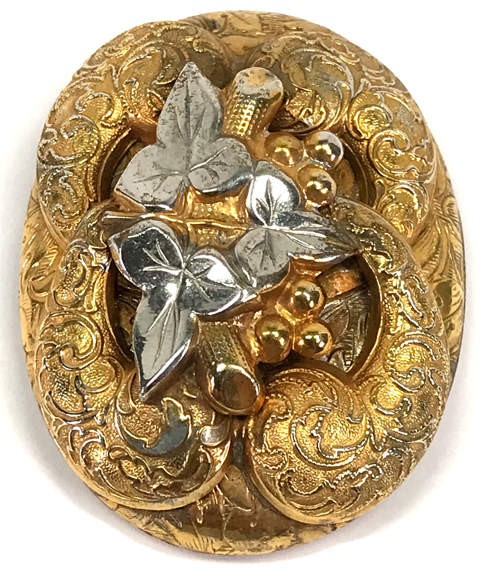 Antique grape cluster leaves & scrolls silvetone & goldtone metal clip brooch. (1 of 7)