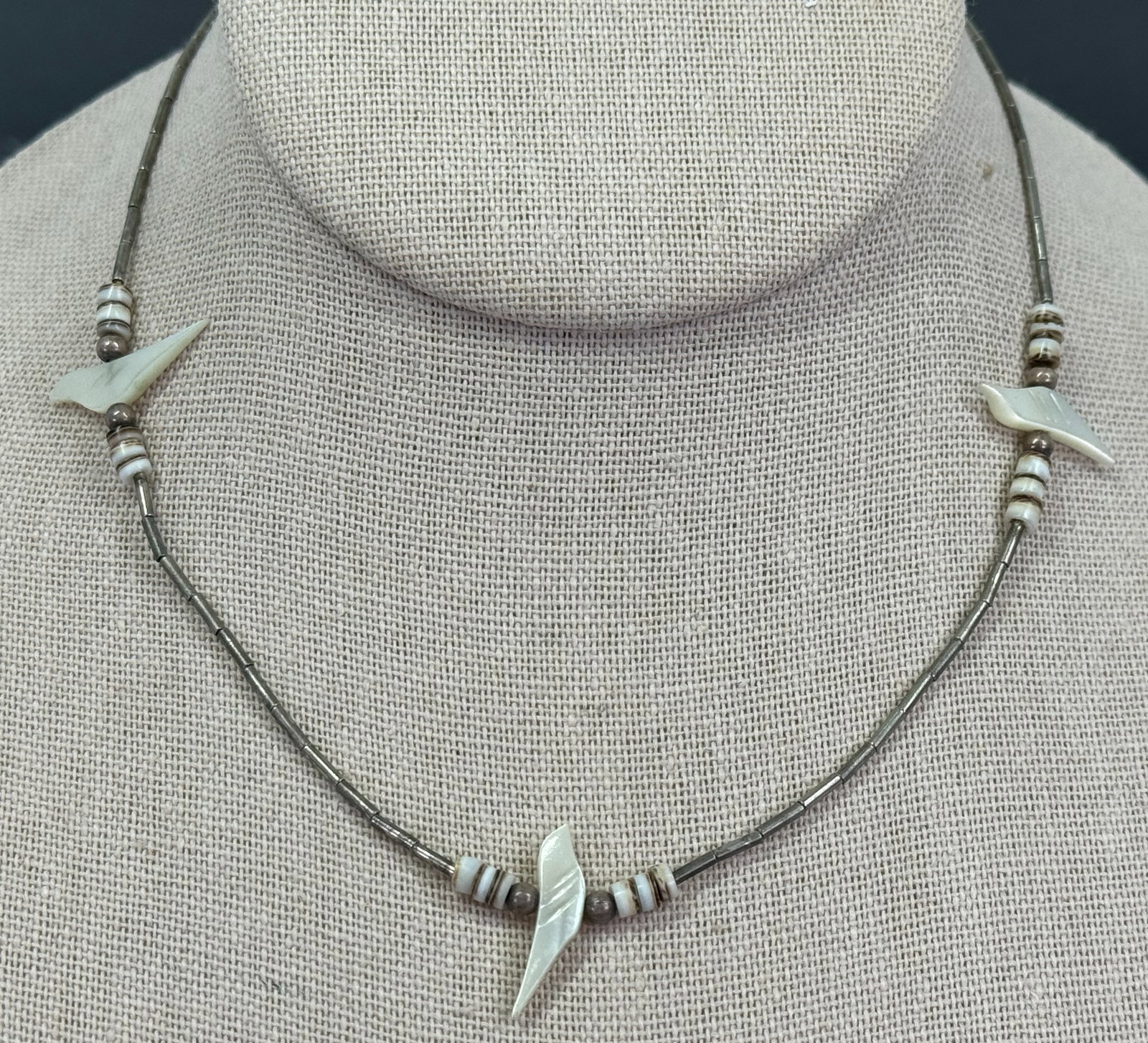 Vintage native american MOP bird fetish heishi liquid silver beaded choker necklace.: Vintage native american MOP bird fetish heishi liquid silver beaded choker necklace. For measures please refer to the pictures taken with a measuring tape. Weight: 6 Grams. This is a NO RESERVE AUCTIO