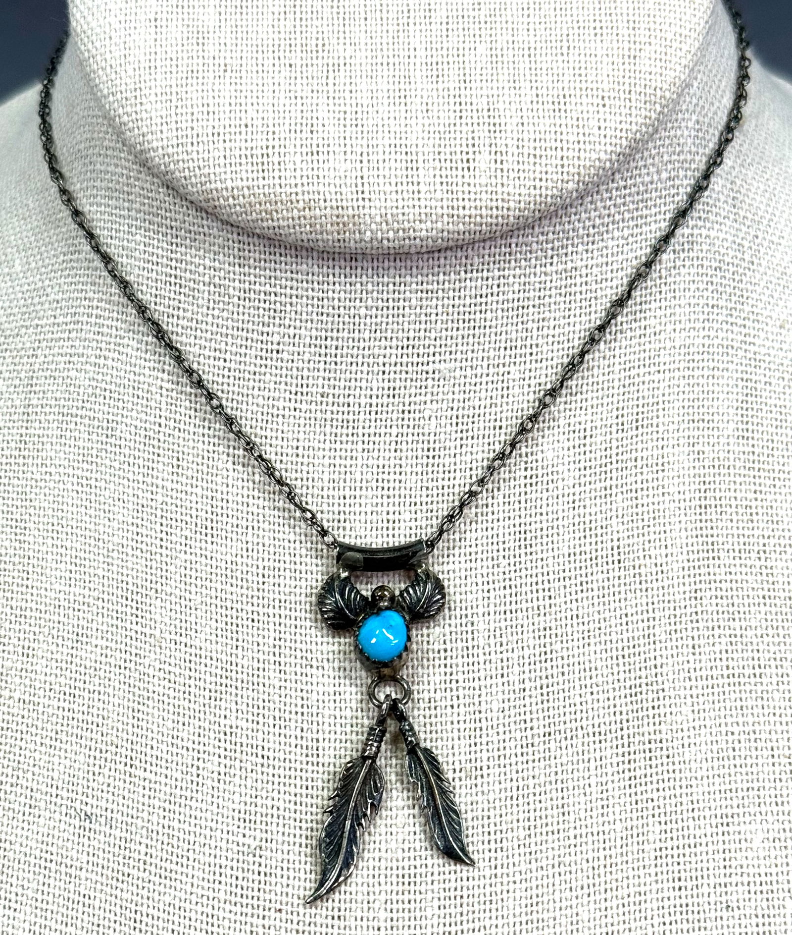 Vintage Navajo turquoise sterling silver chained sliding medallion with dangling feathers necklace.: Vintage Navajo turquoise sterling silver chained sliding medallion with dangling feathers necklace. Marked 925 on medallion and in chain”s clasp. For measures please refer to the pictures taken