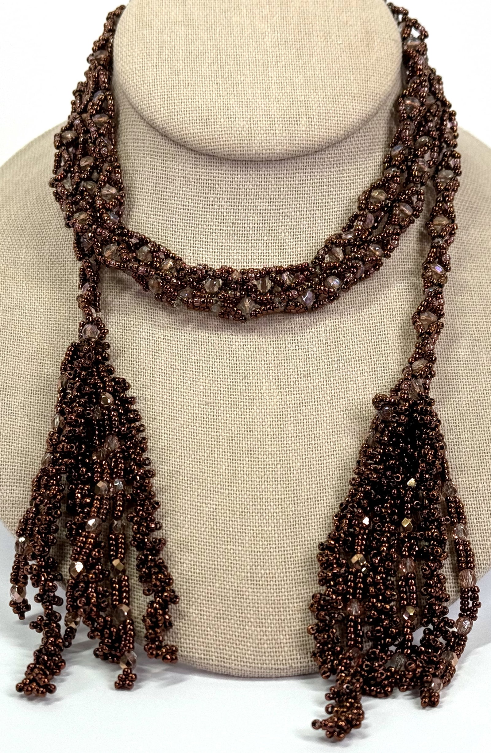 Vintage flapper style artsy AB crystals & glass woven beadwork lariat necklace with tassels.: Vintage flapper style artsy AB crystals & glass woven beadwork lariat necklace with tassels. Unmarked. < For measures please refer to the pictures taken with a measuring tape. Weight: 53 Grams. This i