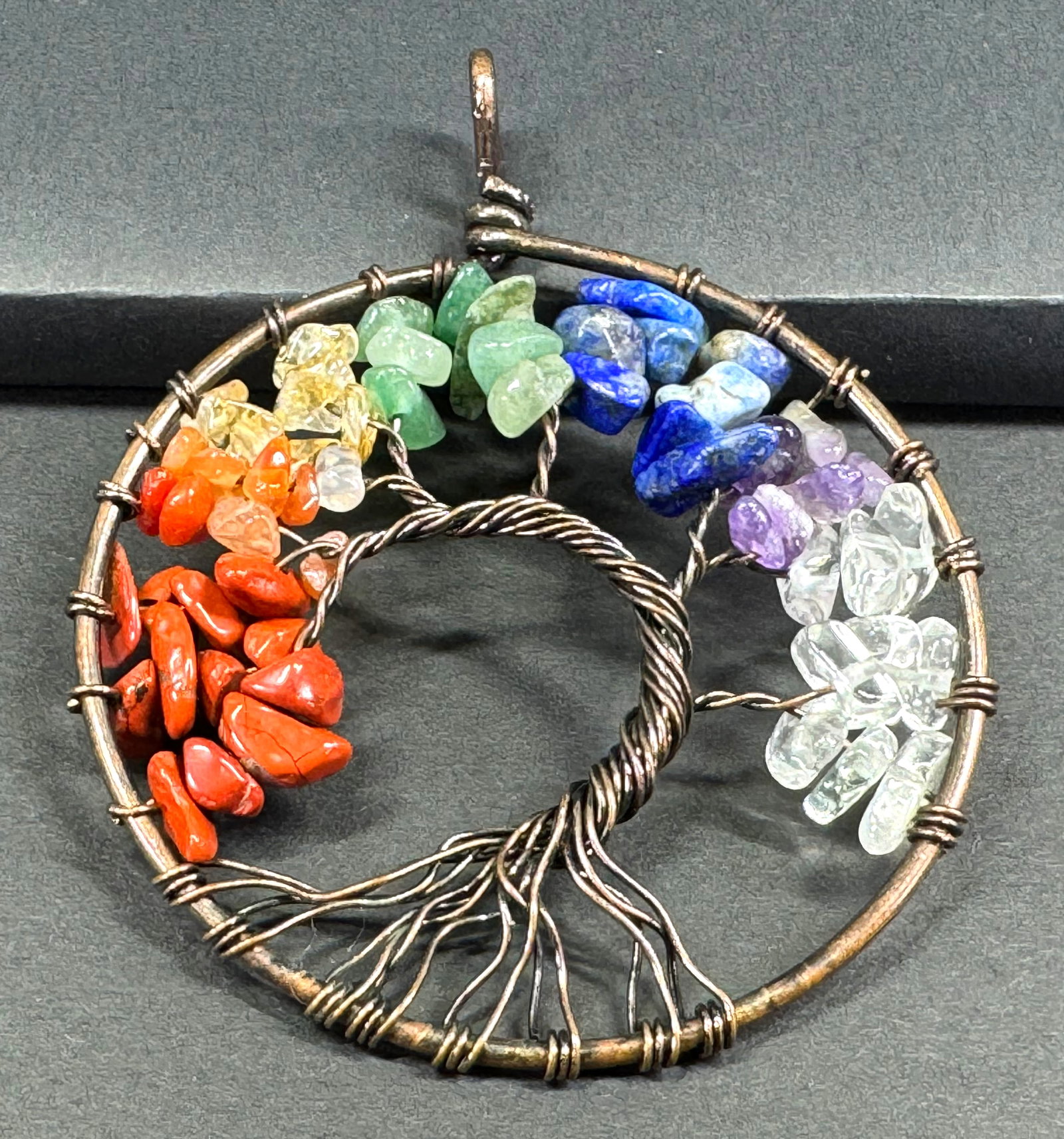 Color gemstone beads wired tree of life pendant.: Color gemstone beads wired tree of life pendant. Unmarked. For measures please refer to the pictures taken with a measuring tape. Weight 11 Grams. This is a NO RESERVE AUCTION: there are no hidden or 
