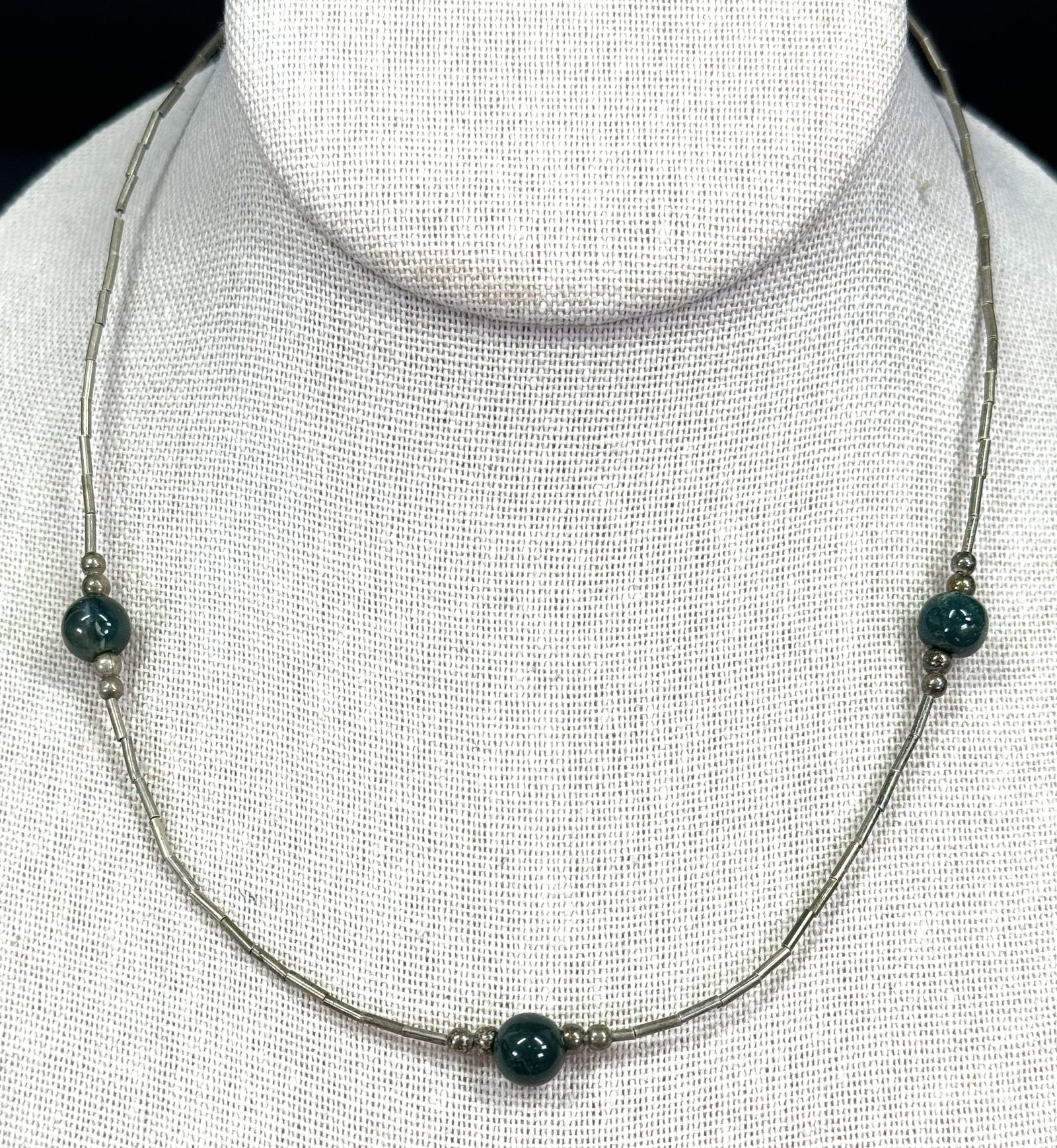 Vintage native american heliotrope stone and liquid silver beaded choker necklace.: Vintage native american heliotrope stone and liquid silver beaded choker necklace. Unmarked. For measures please refer to the pictures taken with a measuring tape. It measures around 16 inches long. W