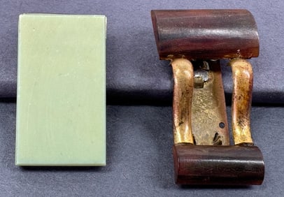 Antique art deco galalith and metal clip brooches.