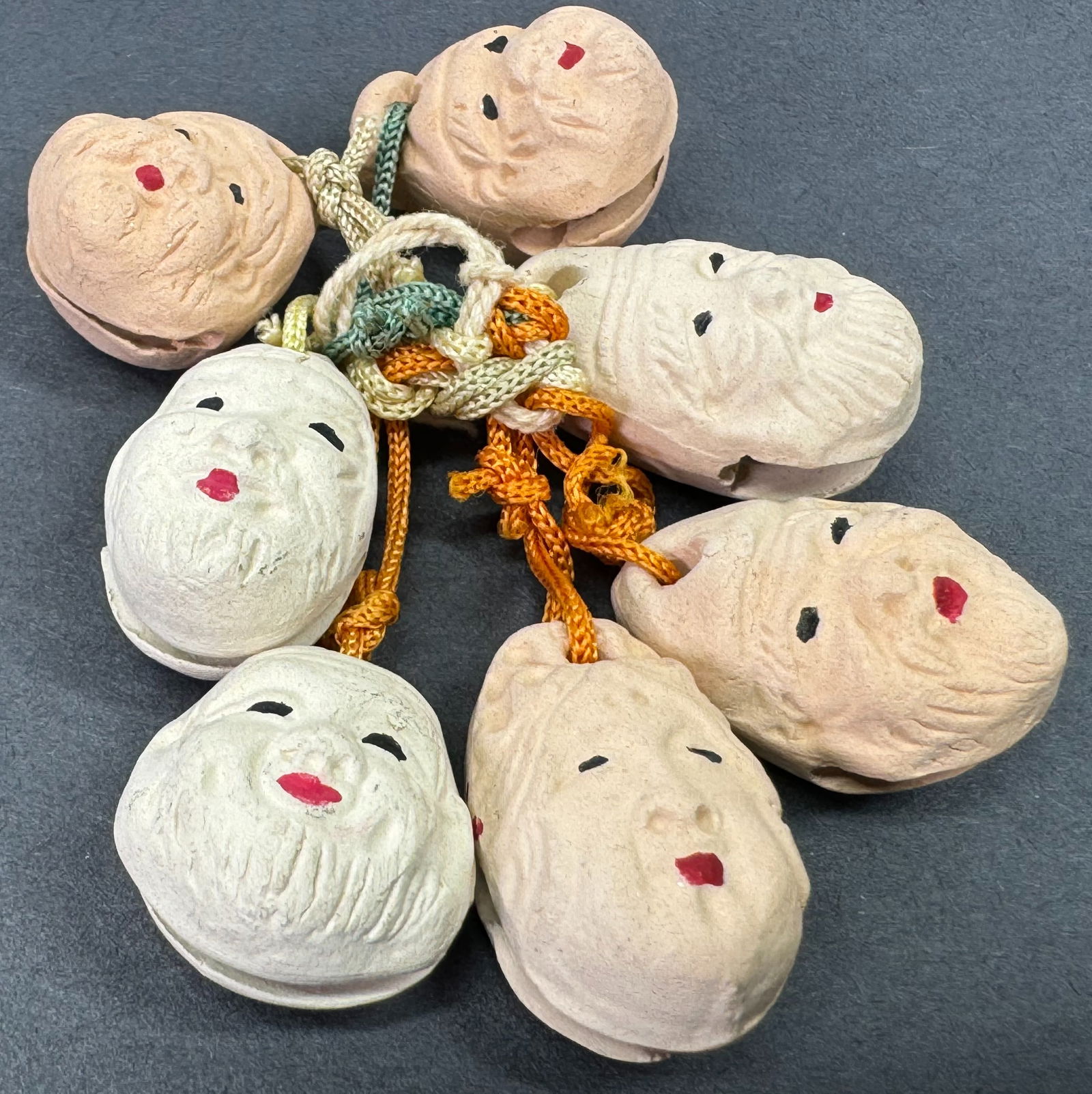 Vintage Japanese Seven Lucky Gods Clay Bell Charms.: Vintage Japanese Seven Lucky Gods Clay Bell Charms.Silky cords . Marked on the back. For measures please refer to the pictures taken with a measuring tape. Weight: 20 Grams. This is a NO RESERVE AUCTI