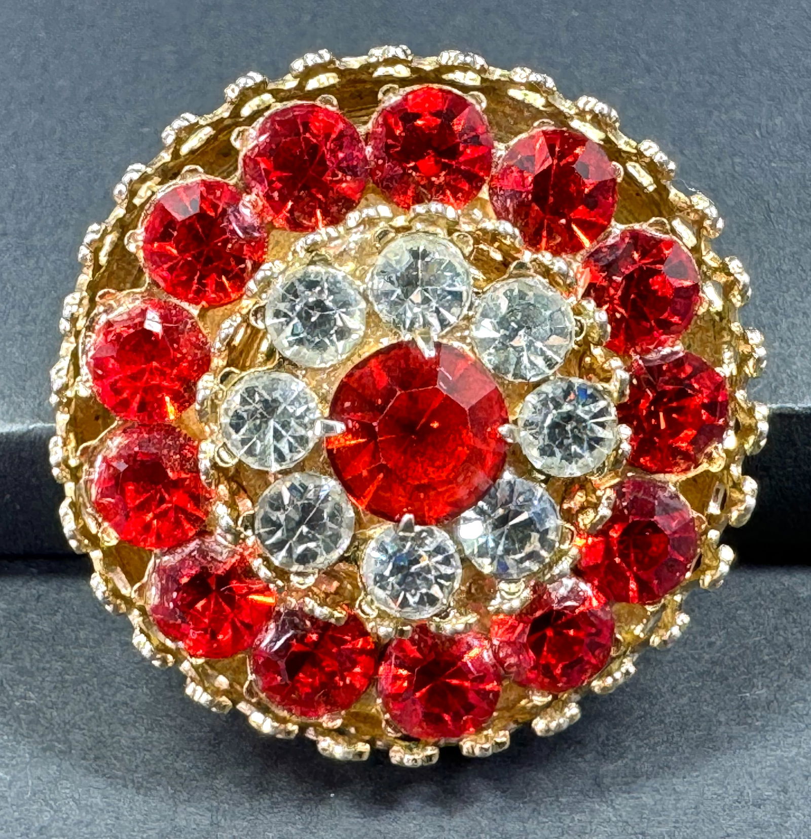 Vintage Coro Red & Clear Crystals Goldtone Metal Rounded Flower Pin Brooch.: Vintage Coro Red & Clear Crystals Goldtone Metal Rounded Flower Pin Brooch. Marked. For measures please refer to the pictures taken with a measuring tape. Weight: 12 Grams. This is a NO RESERVE AUCTIO