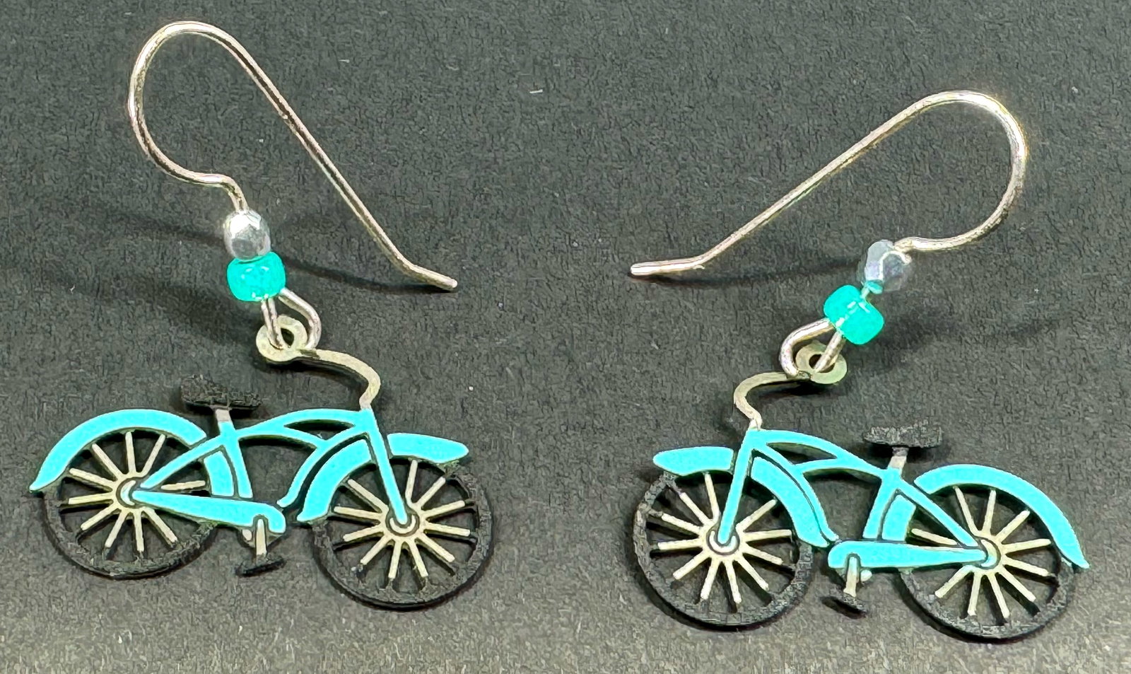 Enamel metal bike dangle hook earrings.: Enamel metal bike dangle hook earrings. Unmarked. For measures please refer to the pictures taken with a measuring tape. Weight: 2 Grams. This is a NO RESERVE AUCTION: there are no hidden or confident