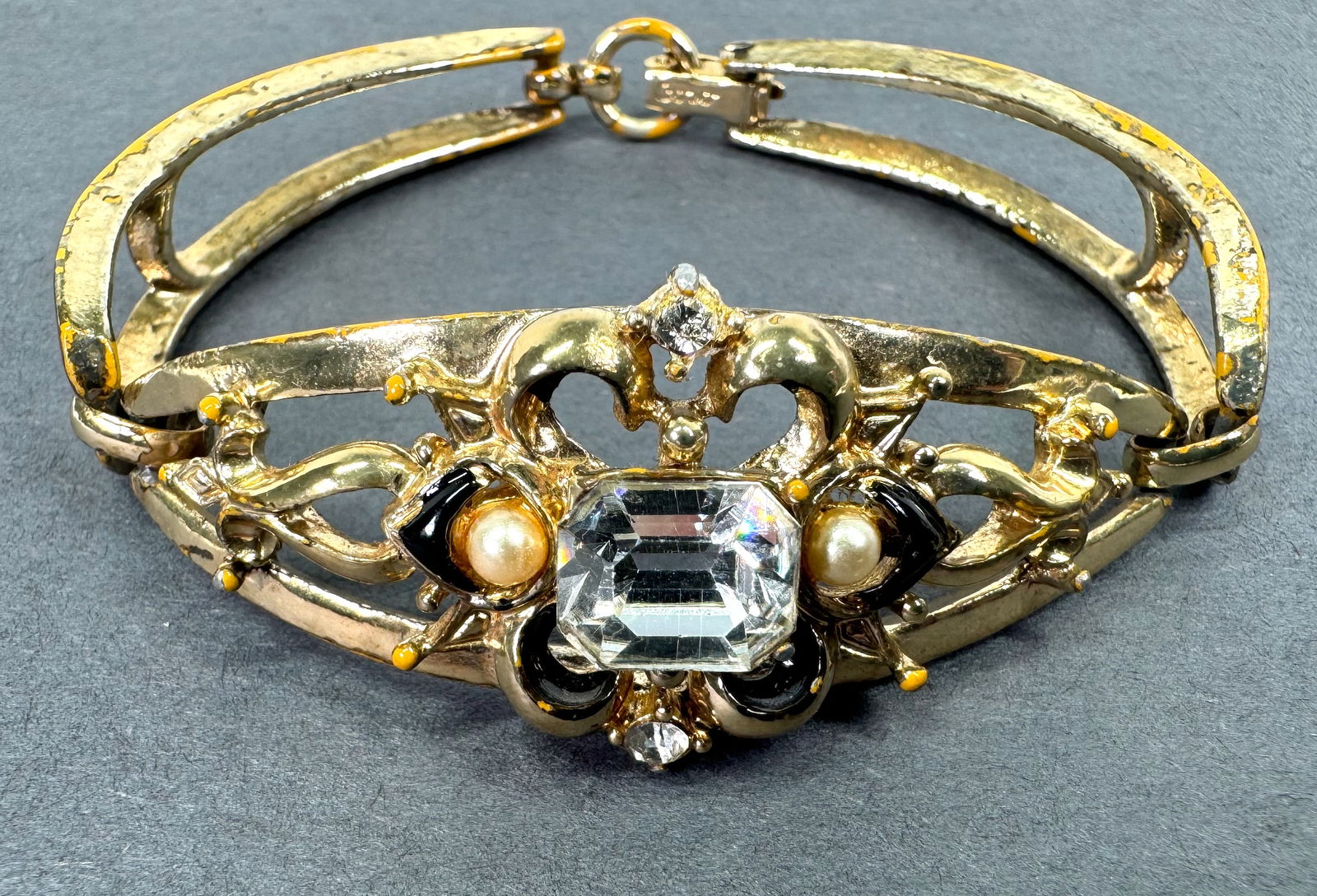 Vintage Coro clear crystal faux pearls black enamel goldtone bracelet.: Vintage Coro clear crystal faux pearls black enamel goldtone metal bracelet. Marked on clasp. For measures please refer to the picture taken with a measuring tape. Weight : 24 Grams. This is a NO RESE
