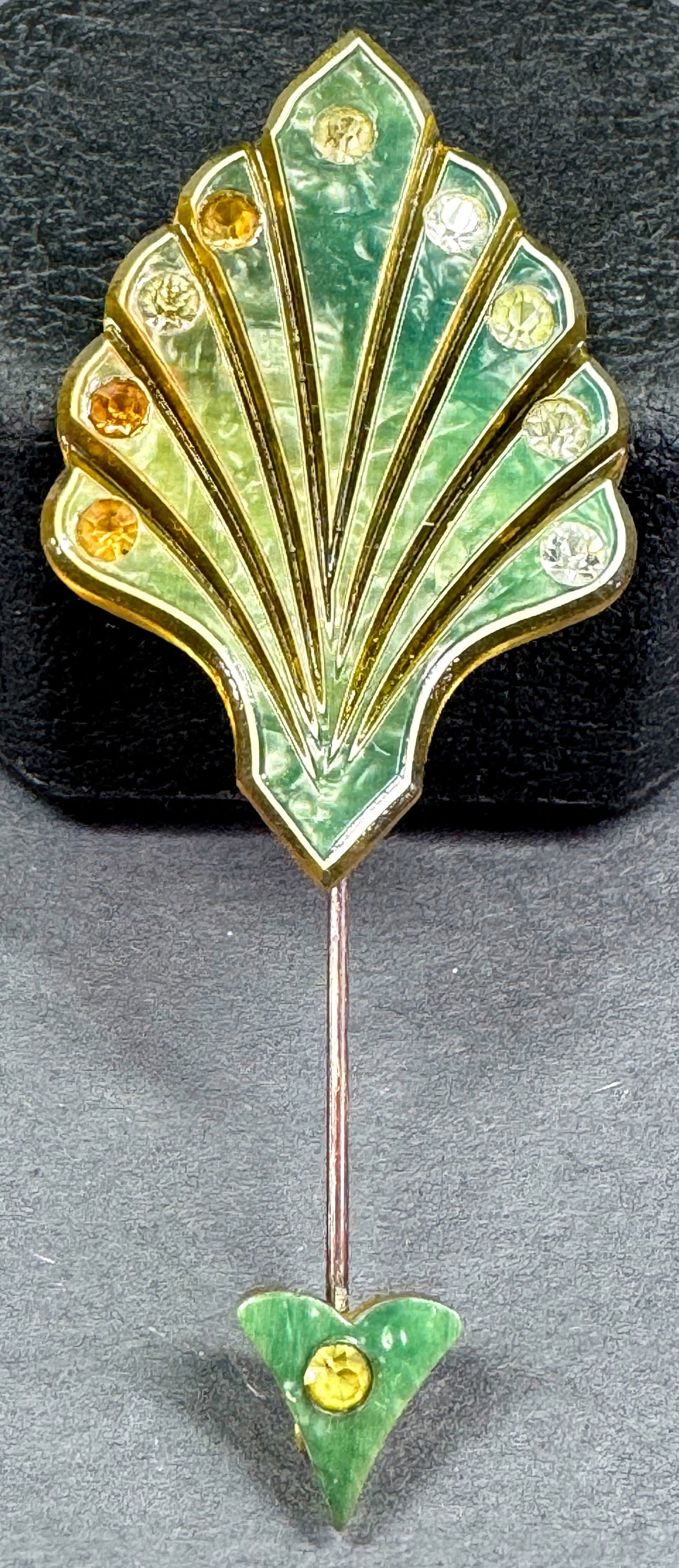 Vintage art deco clear rhinestones inlaid marbles greenish &  appejuice  celluloid jabot pin. (1 of 7)