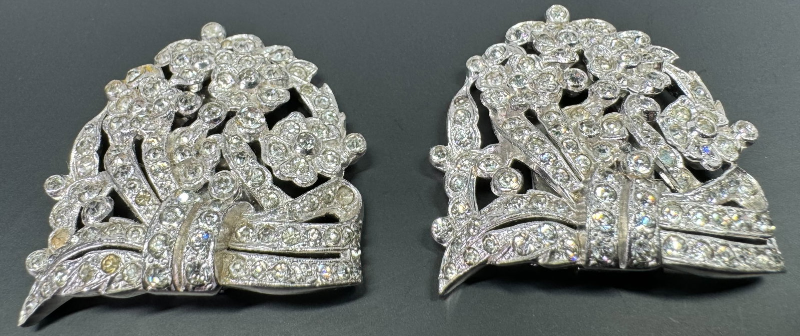 Antique art deco rhinestones silvertone ribbons in bow & flowers clip brooches.: Antique art deco clear rhinestones silvertone metal ribbons in bow & flowers clip brooches. For measures please refer to the picture taken with a measuring tape. Weight : 28 Grams. This is a NO R
