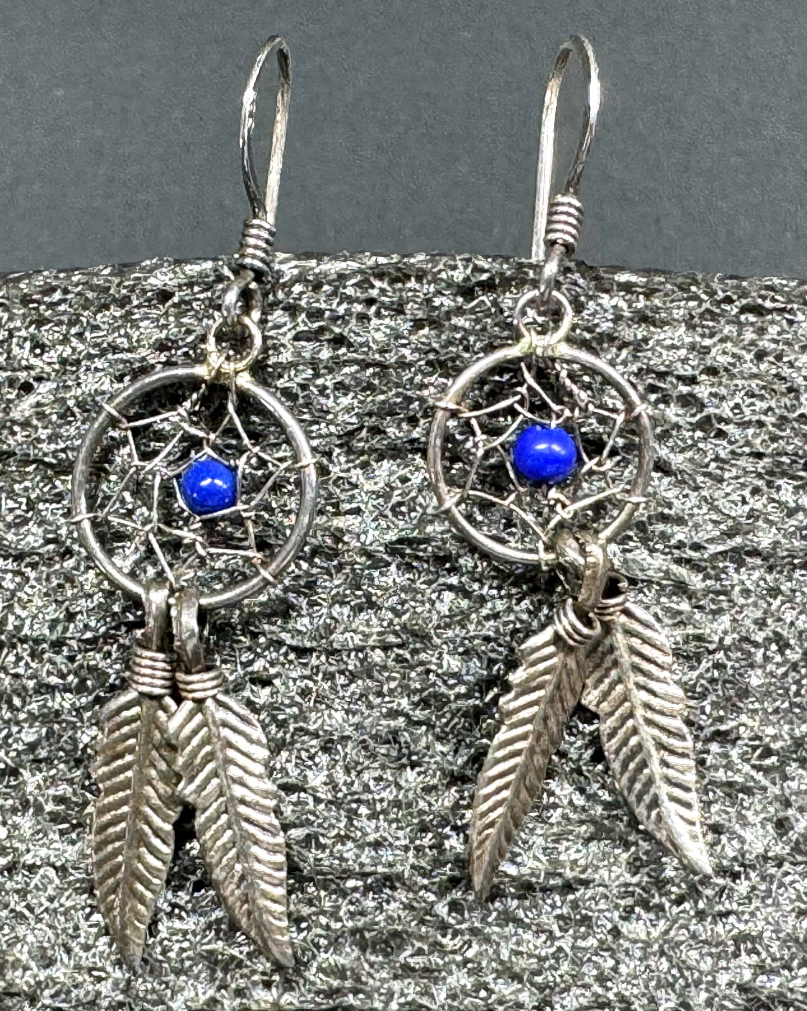 Vintage native american lapis bead sterling silver dreamcatcher hook earrings.: Vintage native american lapis bead sterling silver dreamcatcher hook earrings. Marked 925 on hook. For measures please refer to the pictures taken with a measuring tape. Weight: 1.28 Grams. This is a 