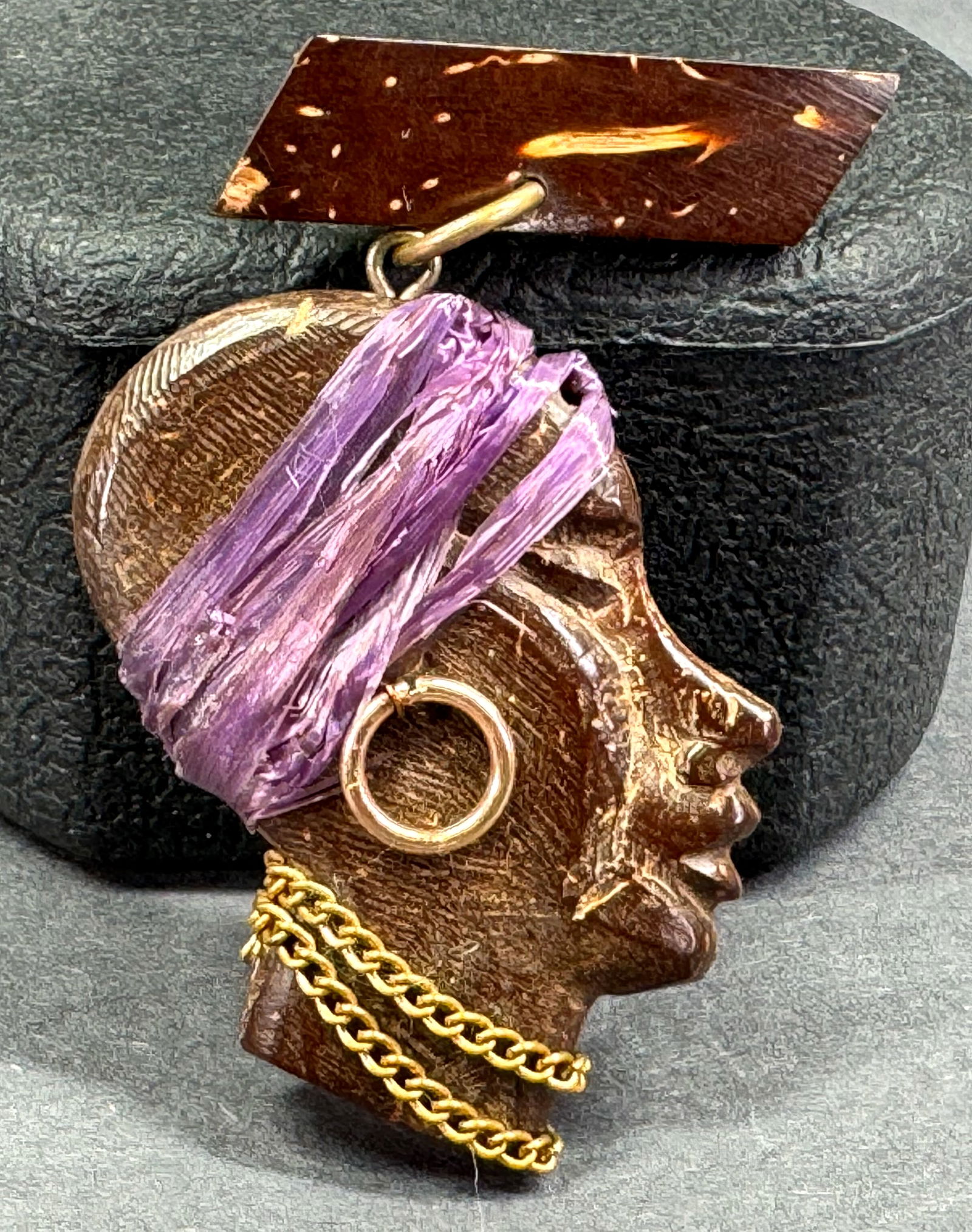 Vintage goldtone metal & purple raffia carved wood double sided face dangling blackamoor pin brooch (1 of 9)