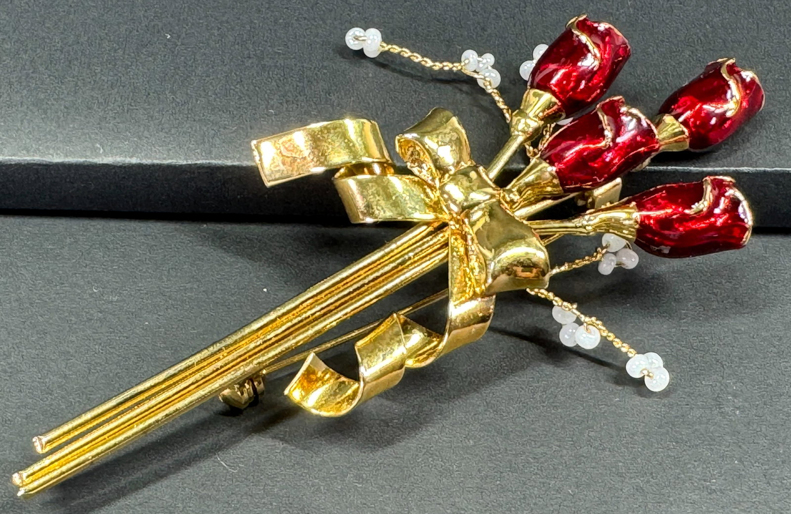 Vintage glass beaded buds red enamel goldtone metal flowers bow bouquet pin brooch.: Vintage glass beaded buds red enamel goldtone metal flowers bow bouquet pin brooch. Unmarked. For measures please refer to the pictures taken with a measuring tape. Weight: 22 Grams. This is a NO RESE