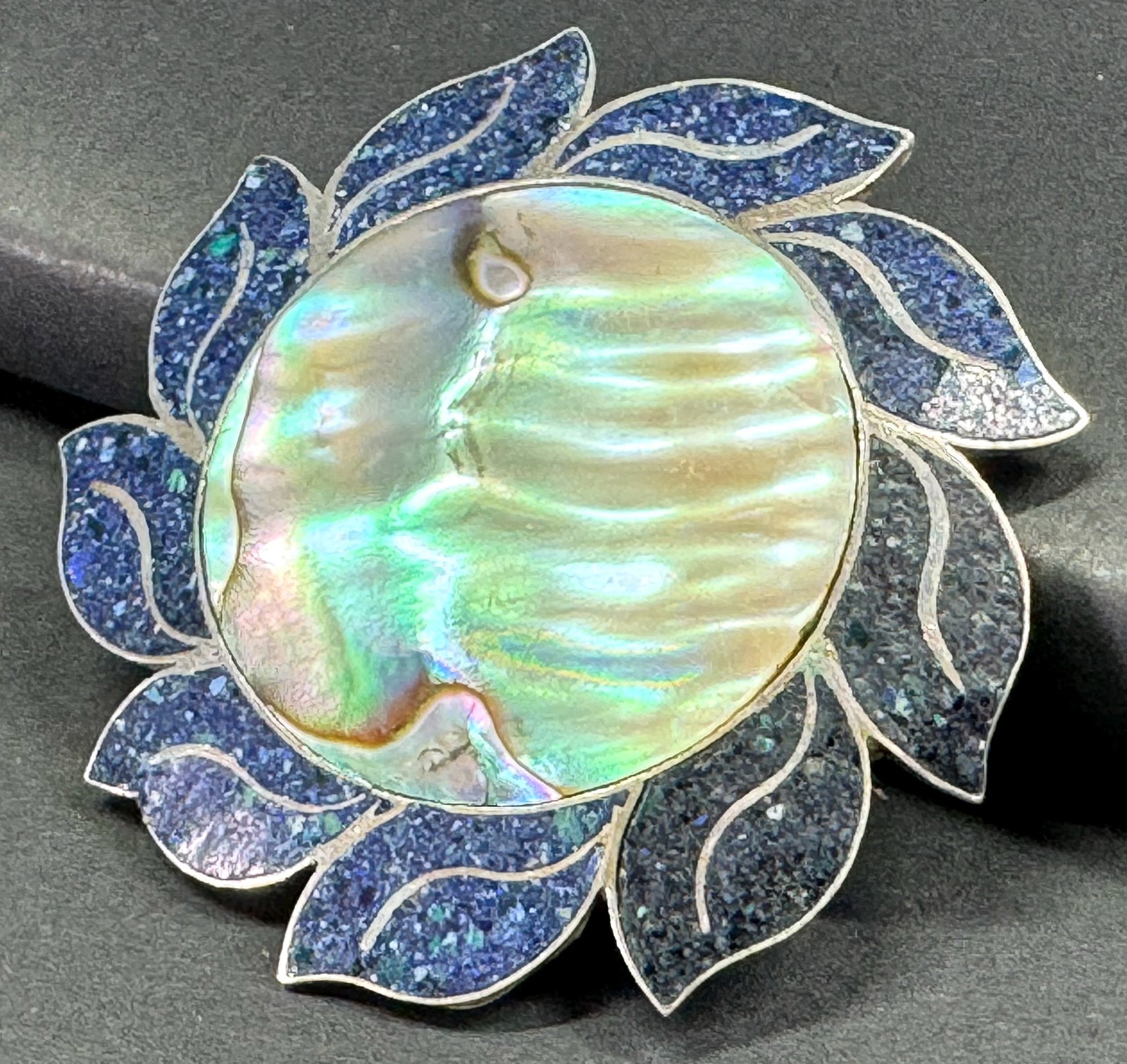 Vintage HDA Taxco Mexico abalone & lapis inlay sterling silver pinwheel flower brooch pendant: Vintage HDA Taxco Mexico abalone & chipped lapis inlay sterling silver pinwheel flower brooch pendant. Marked HDA, Hecho en Mexico, Taxco 925. For measures please refer to the pictures taken with a me
