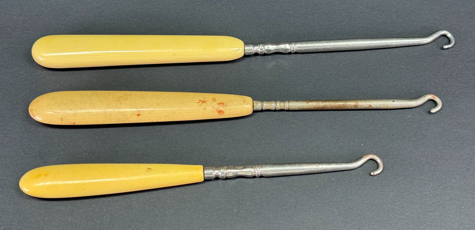 Antique celluloid and metal shoe,  gloves button hooks. Lot of 3 (1 of 1)