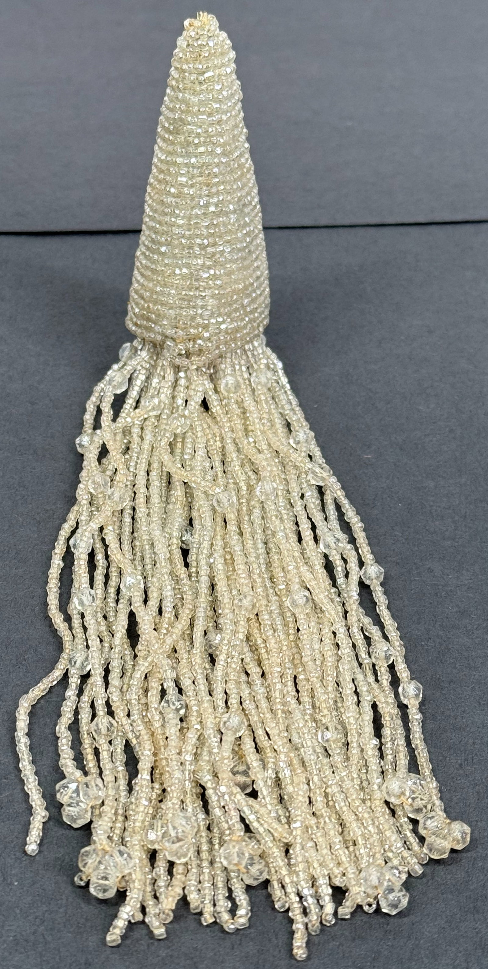 Antique flapper clear glass beaded tassel with long fringe jewelry crafts making.: Antique flapper clear glass beaded tassel with long fringe jewelry crafts making. For measures please refer to the pictures taken with a measuring tape. Weight: 42 Grams. This is a NO RESERVE AUCTION: