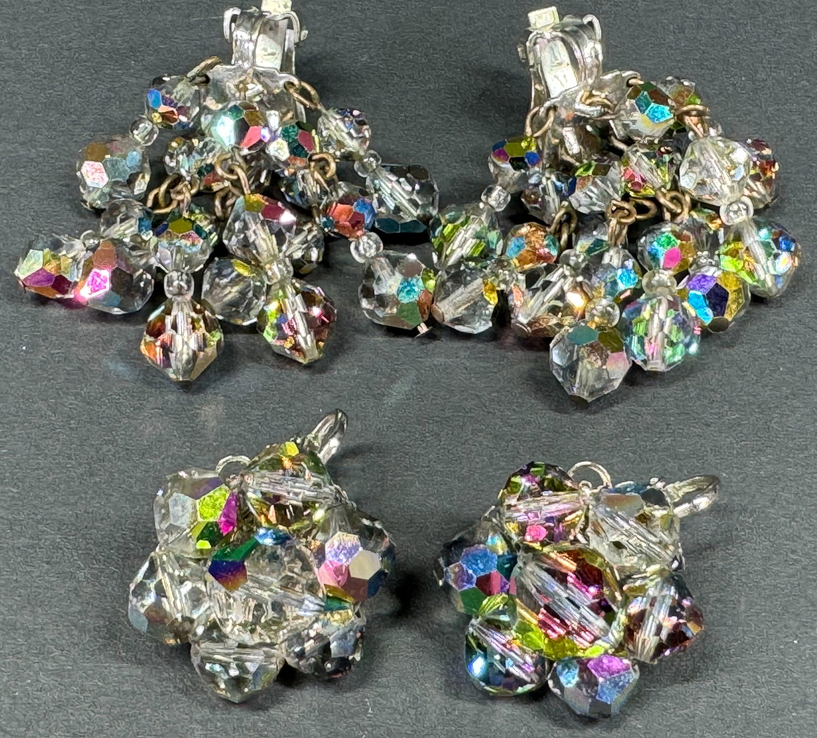 Vintage AB crystals beads silvertone metal flower & waterfall clip on earrings.: Vintage AB crystals beads silvertone metal flower & waterfall clip on earrings. Both unmarked. For measures please refer to the pictures taken with a measuring tape. Weight: 34 Grams. This is a NO RES