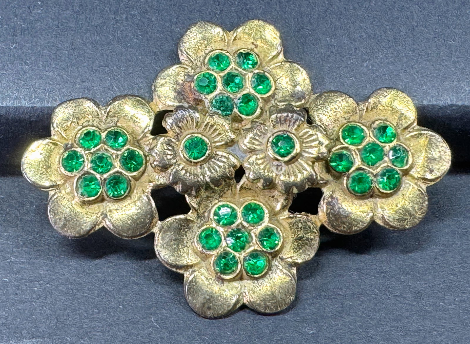 Vintage Czech green rhinestones goldtone metal flowers pin brooch.: Vintage Czech green rhinestones goldtone metal flowers pin brooch. Unmarked For measures please refer to the pictures taken with a measuring tape. Weight: 3 Grams. This is a NO RESERVE AUCTION: there 